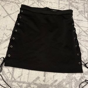 black pencil skirt with metal rings and string